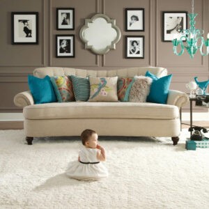 Cute baby sitting on bright carpet | Tri-City Carpet | Vista, CA