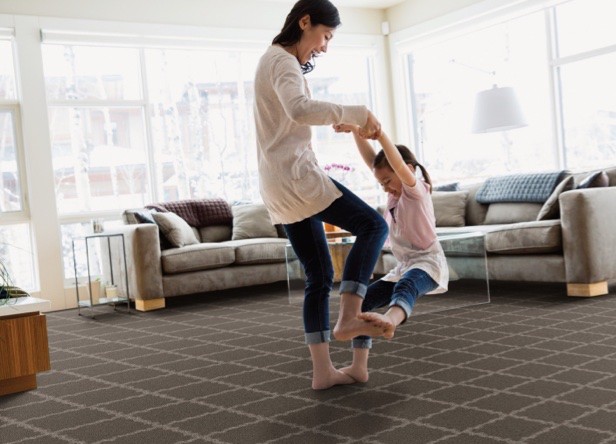 Mother dancing with her daughter on her feet | Tri-City Carpet | Vista, CA